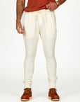 Man modeling the milano pant in white stone