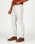 Man modeling the milano pant in pure white