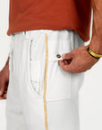 Man modeling the milano pant in pure white