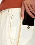 Man modeling the milano pant in white stone