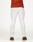 Man modeling the milano pant in pure white