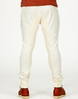 Man modeling the milano pant in white stone
