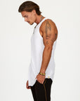 A man modeling a white tank top