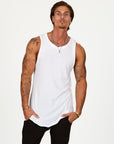 A man modeling a white tank top
