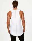 A man modeling a white tank top