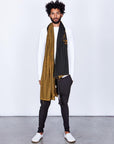 Male modeling gold on black nature wrap