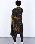 Male modeling gold on black nature wrap