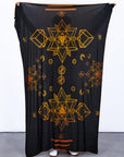 Male modeling gold on black nature wrap
