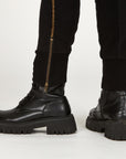 Man modeling the milano pant in black