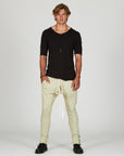 Man modeling the milano pant in ceremony sand