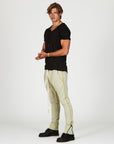Man modeling the milano pant in ceremony sand