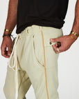 Man modeling the milano pant in ceremony sand