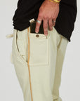 Man modeling the milano pant in ceremony sand
