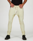 Man modeling the milano pant in ceremony sand
