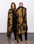 Couple modeling gold Ruben LOVE nature wrap