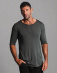 Male modeling grey crew neck shirt