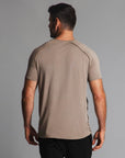Male modeling tan crew neck shirt