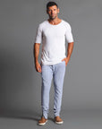 Man modeling the milano pant in blue clay