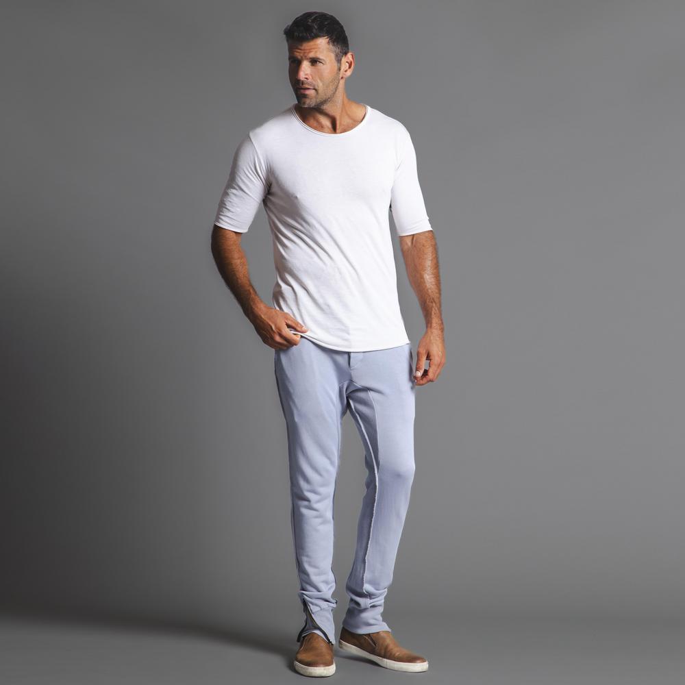 Man modeling the milano pant in blue clay