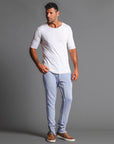 Man modeling the milano pant in blue clay