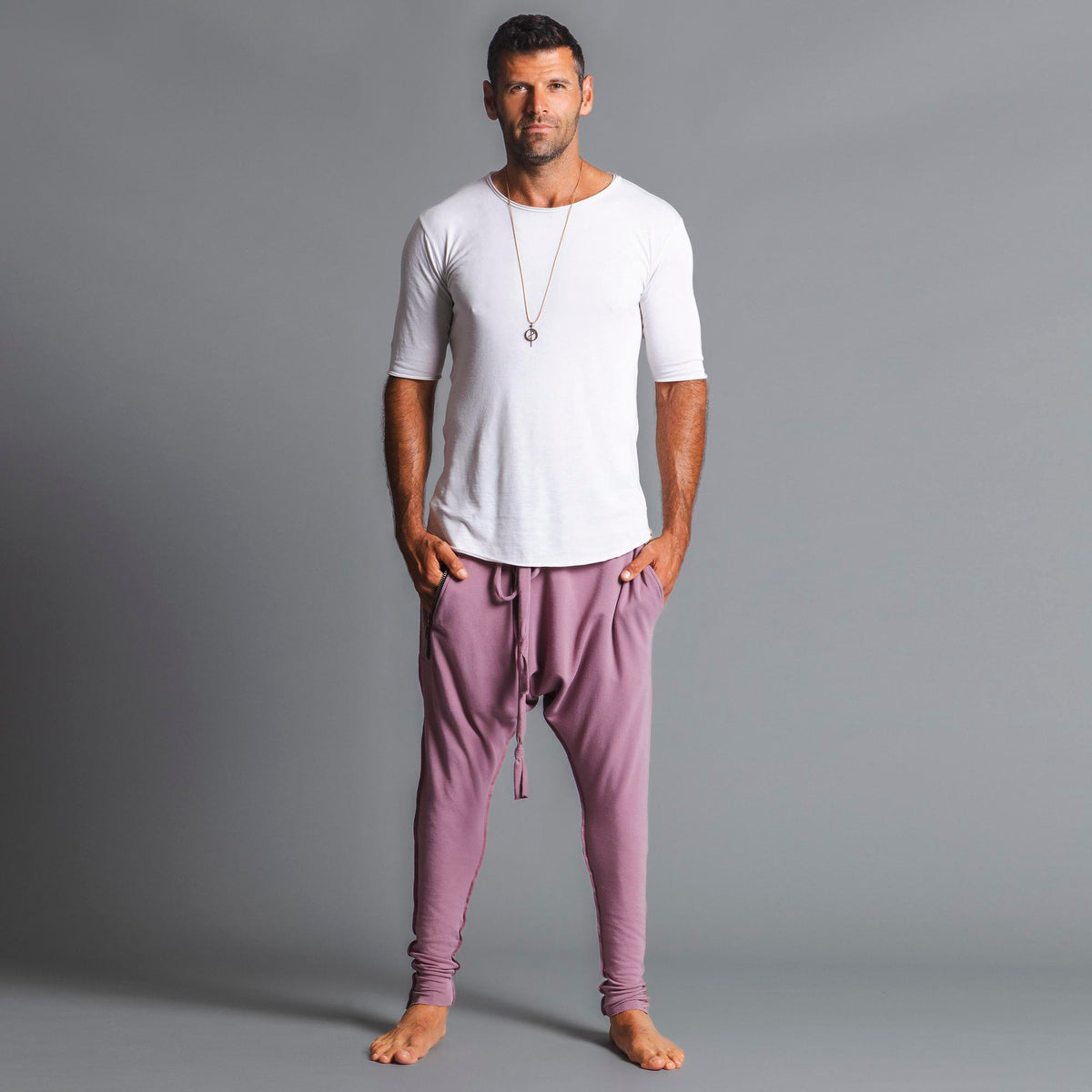 Male modeling Dusty Rose colored pants