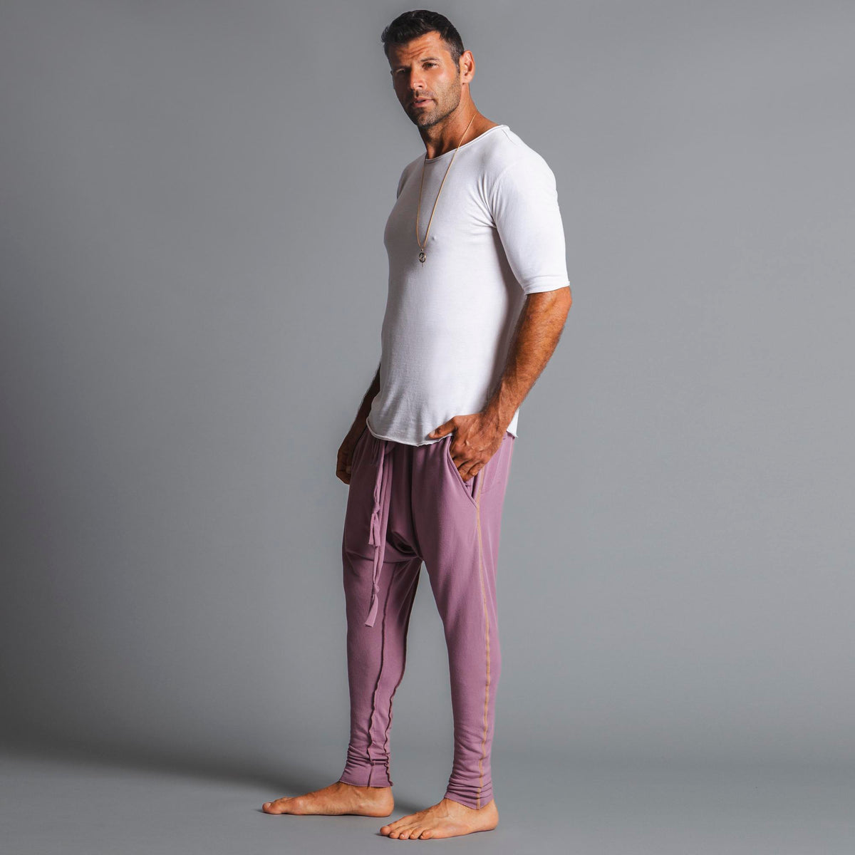 Male modeling Dusty Rose colored pants