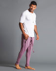 Male modeling Dusty Rose colored pants
