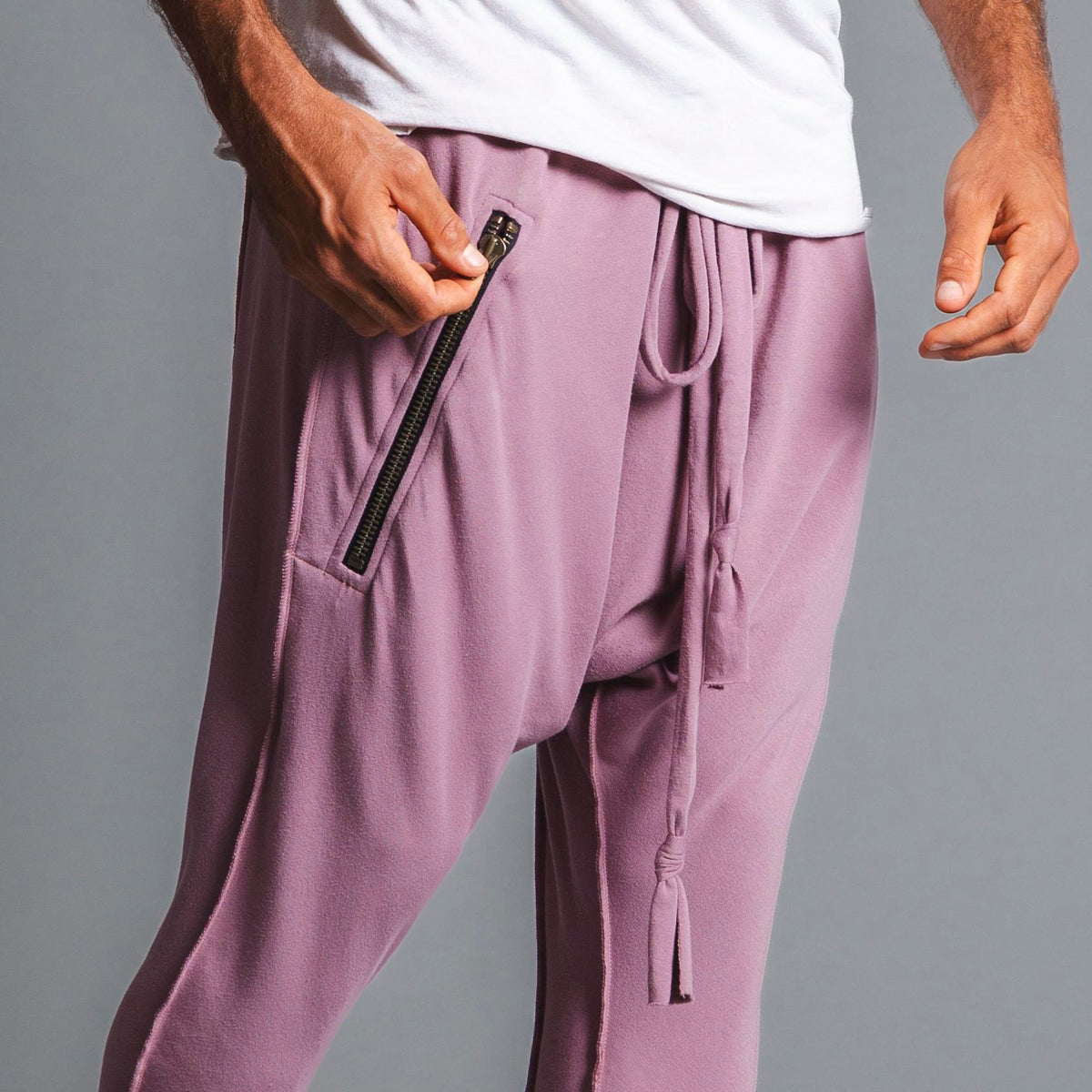 Male modeling Dusty Rose colored pants