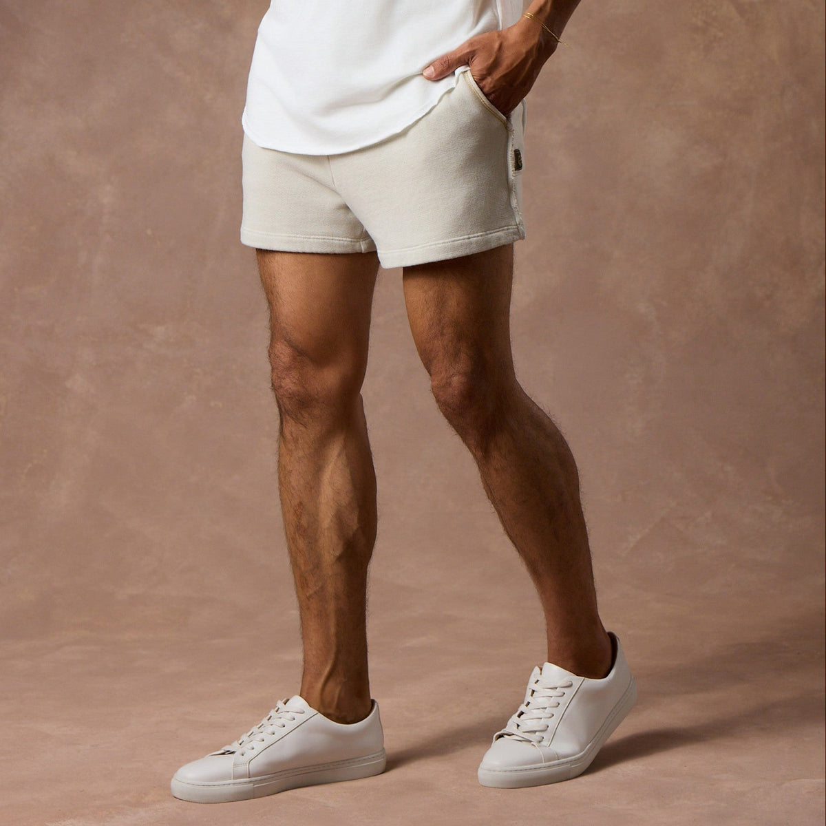 male modeling white stone resort shorts