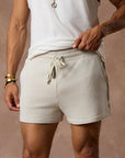 male modeling white stone resort shorts