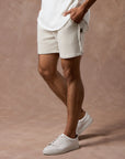male modeling white stone resort shorts