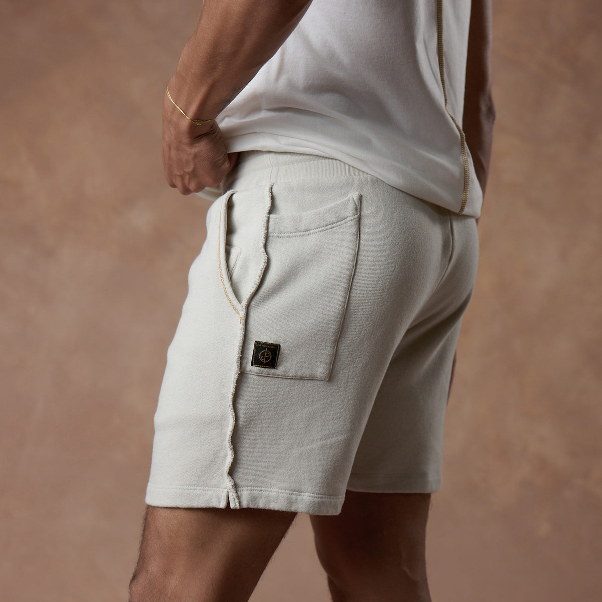 male modeling white stone resort shorts