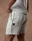 male modeling white stone resort shorts