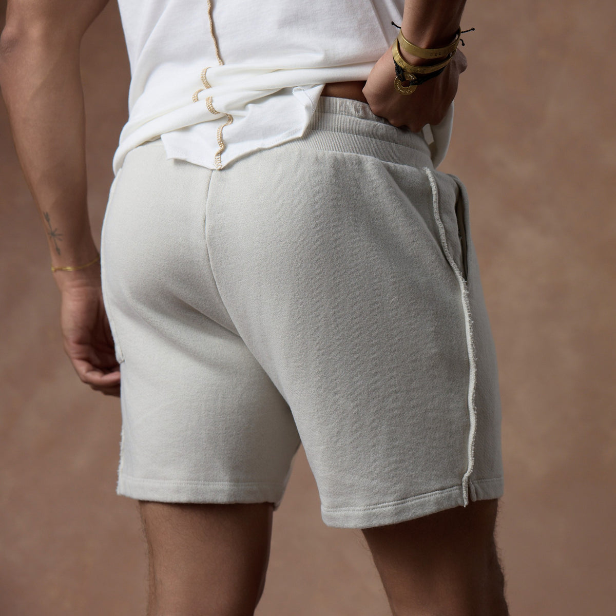 male modeling white stone resort shorts