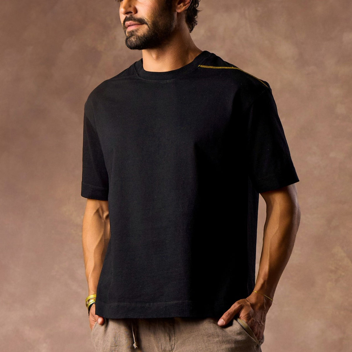 male modeling black boxy tee