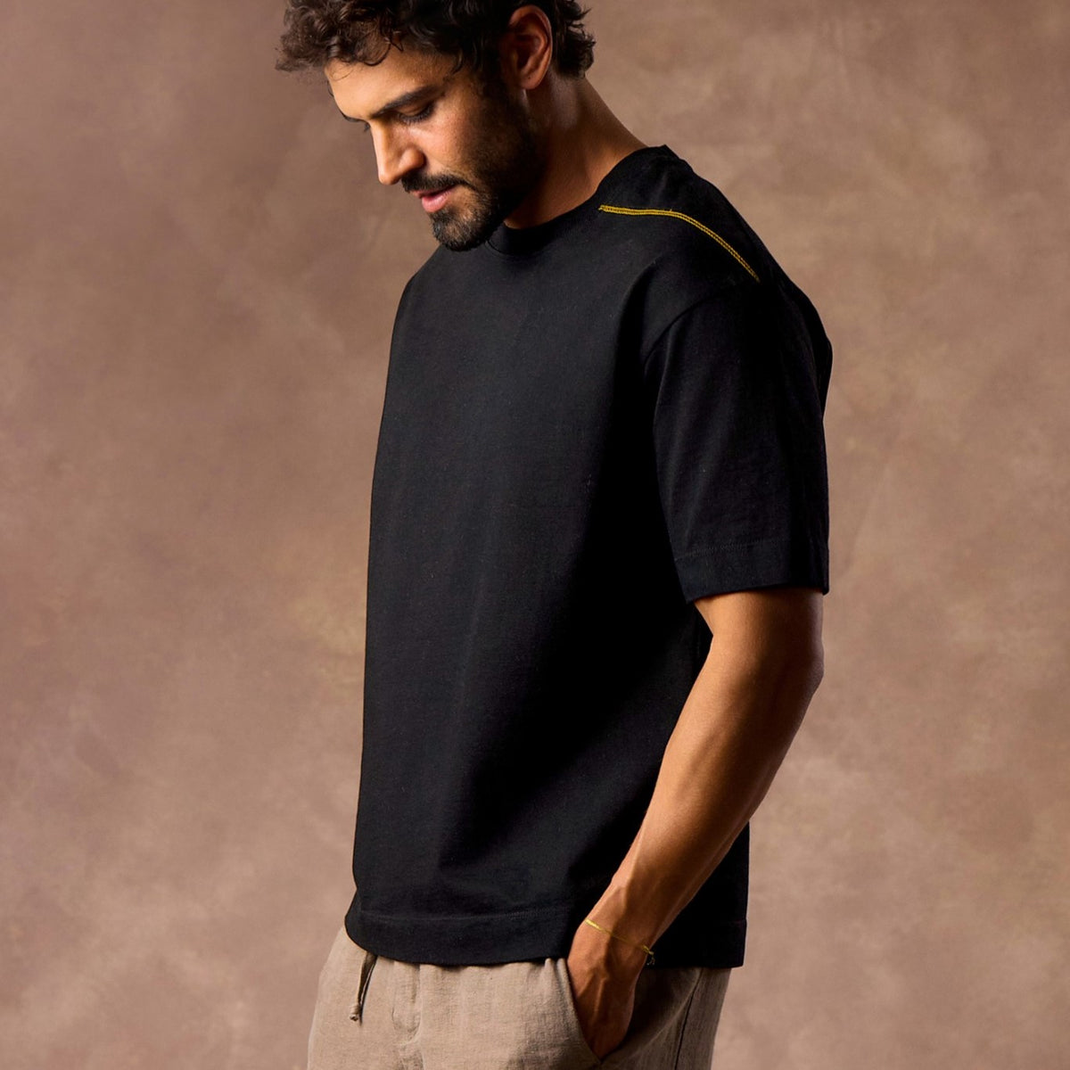 male modeling black boxy tee