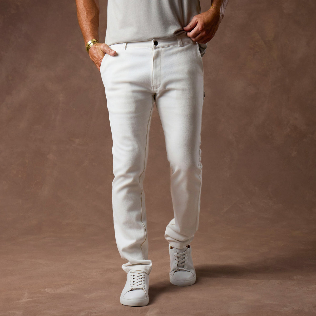 male modeling white elemental slim pants