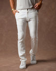 male modeling white elemental slim pants