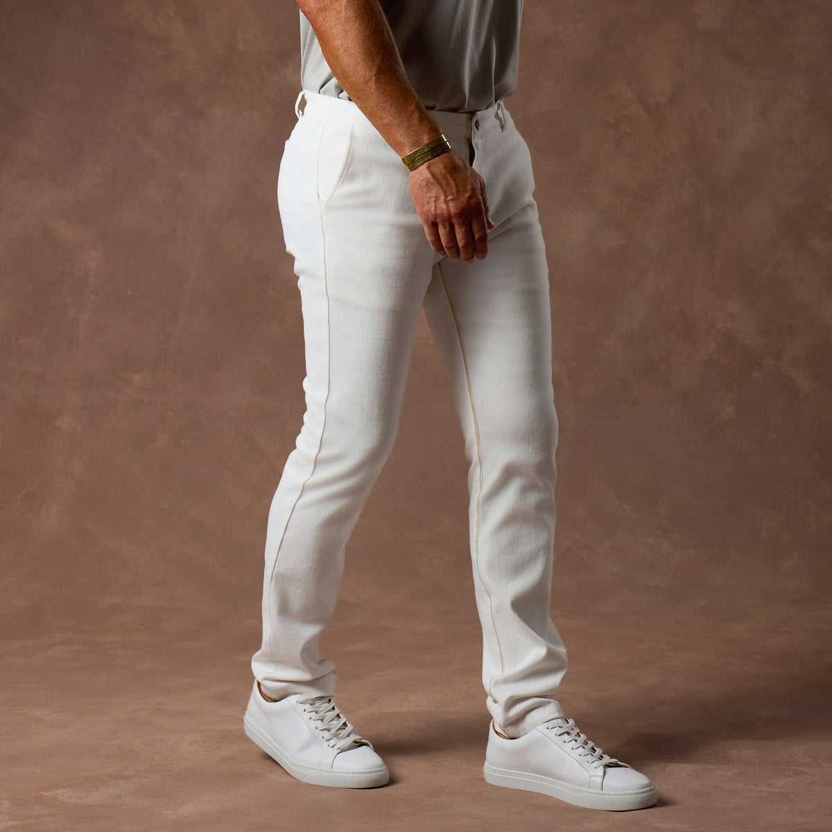 male modeling white elemental slim pants