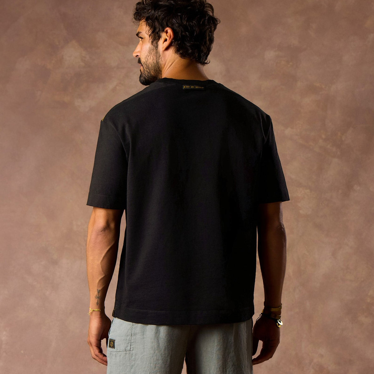 male modeling black boxy tee