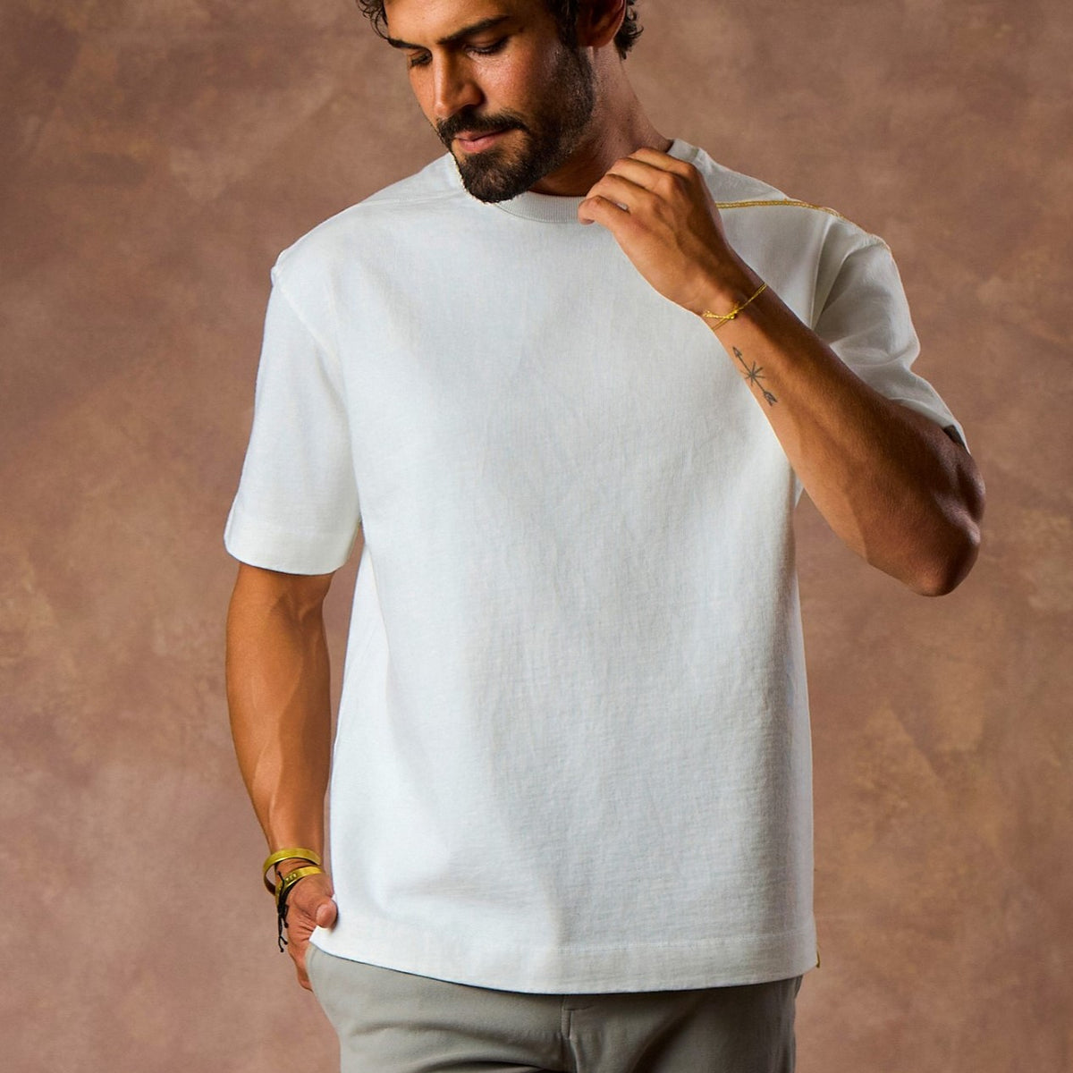 male modeling white boxy tee
