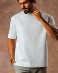 male modeling white boxy tee