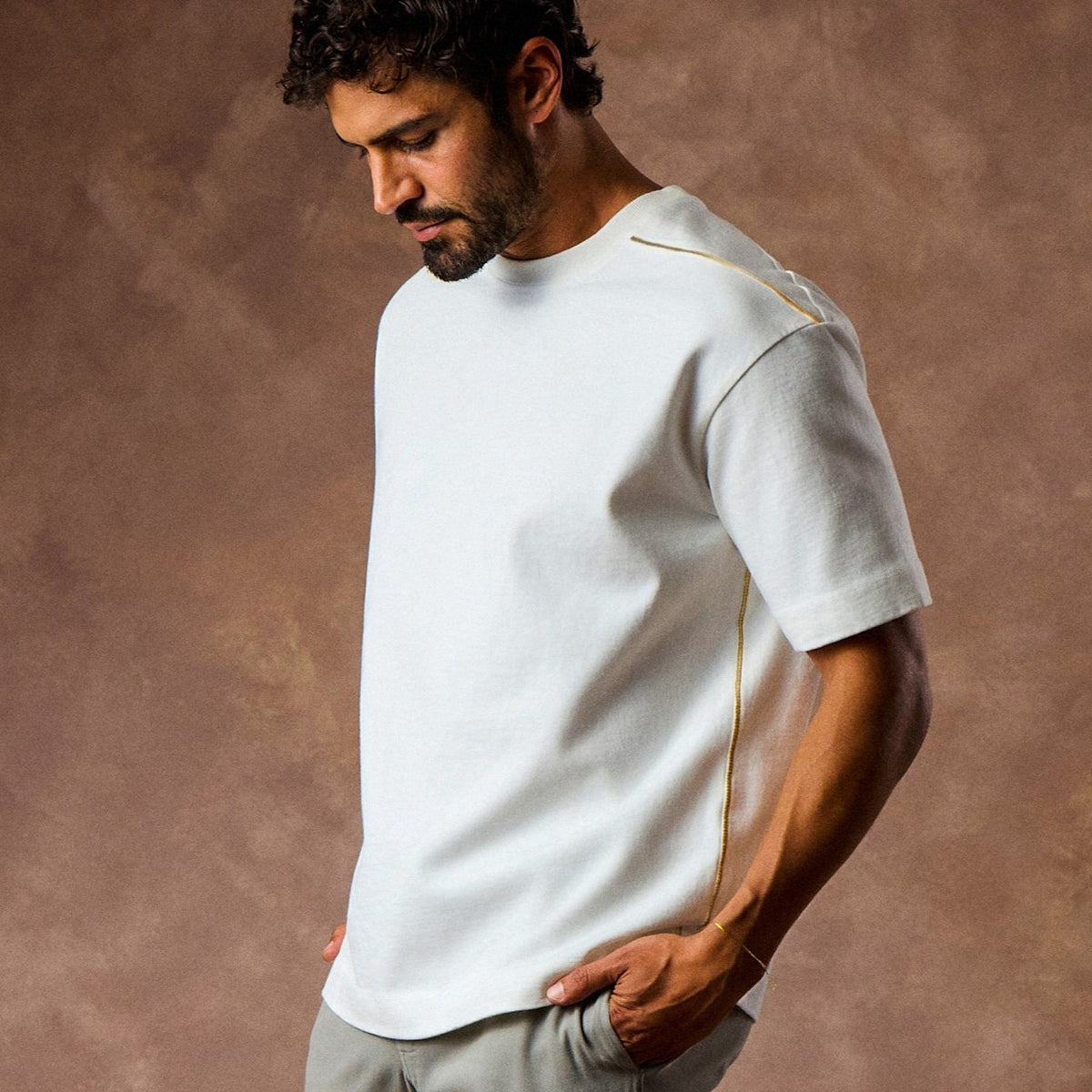 male modeling white boxy tee