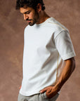 male modeling white boxy tee