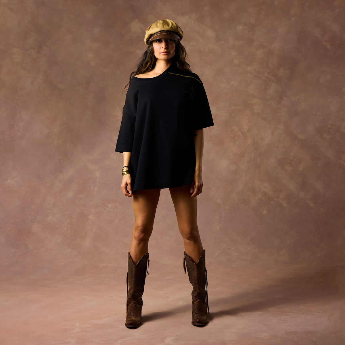 female modeling black boxy tee