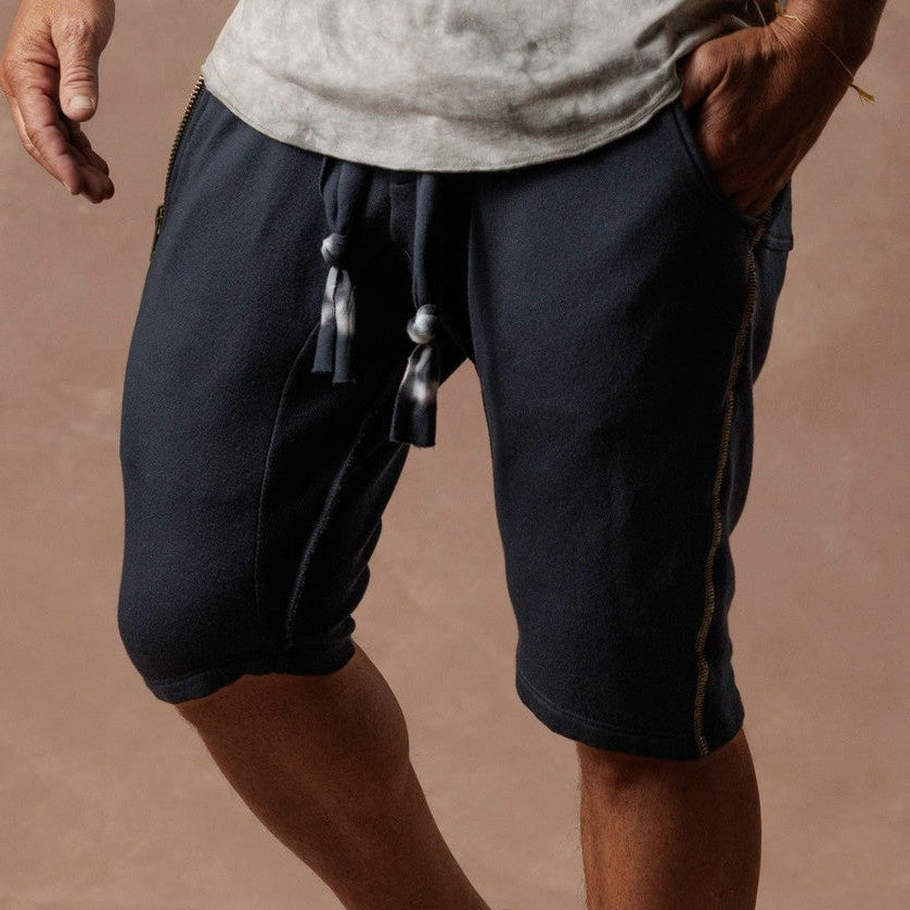 Man modeling milano mids in charcoal blue