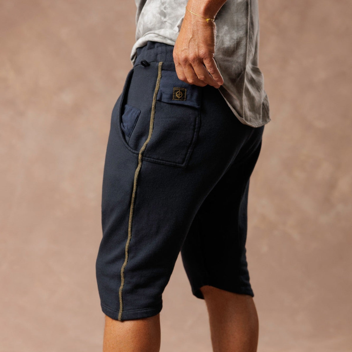Man modeling milano mids in charcoal blue