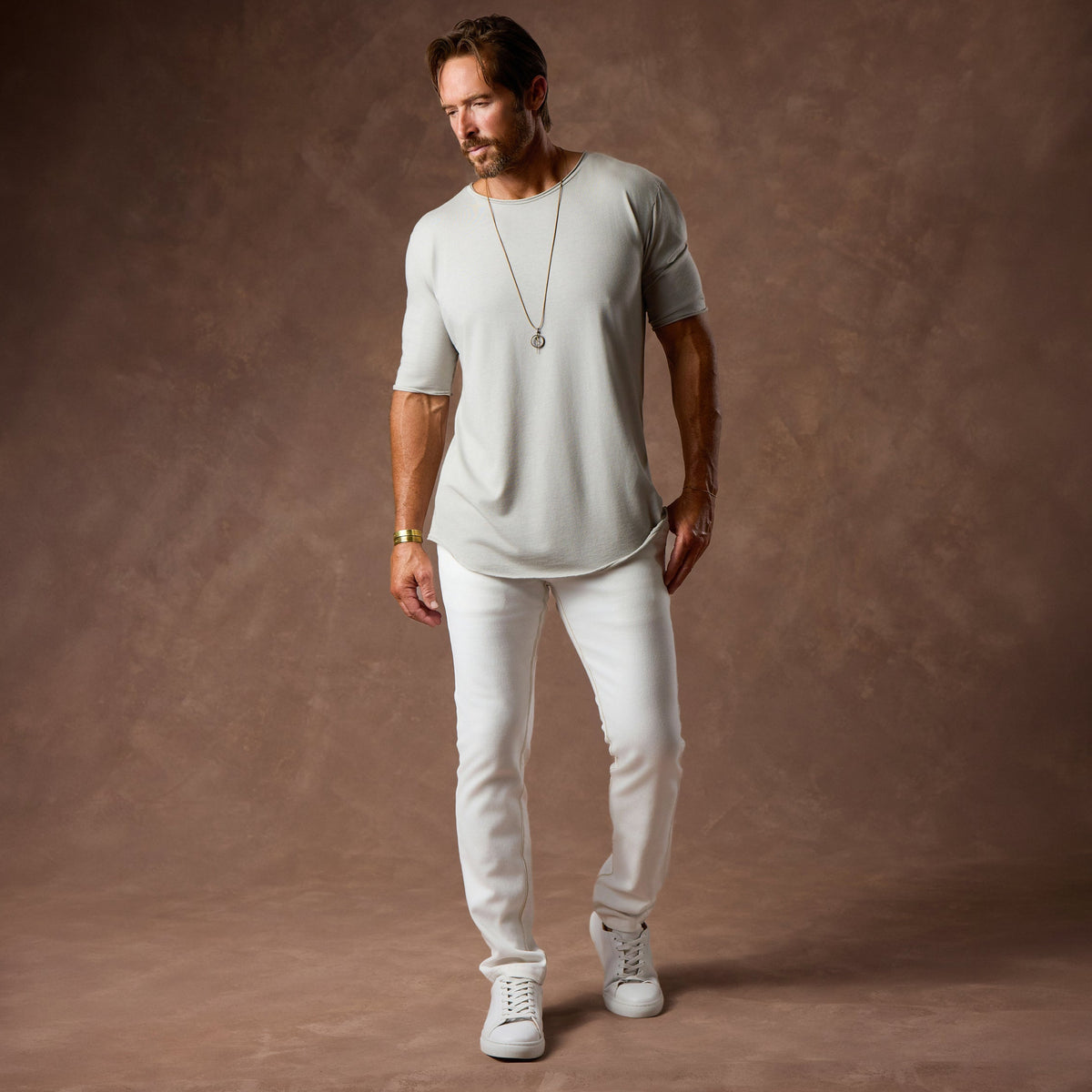 male modeling white elemental slim pants