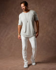 male modeling white elemental slim pants