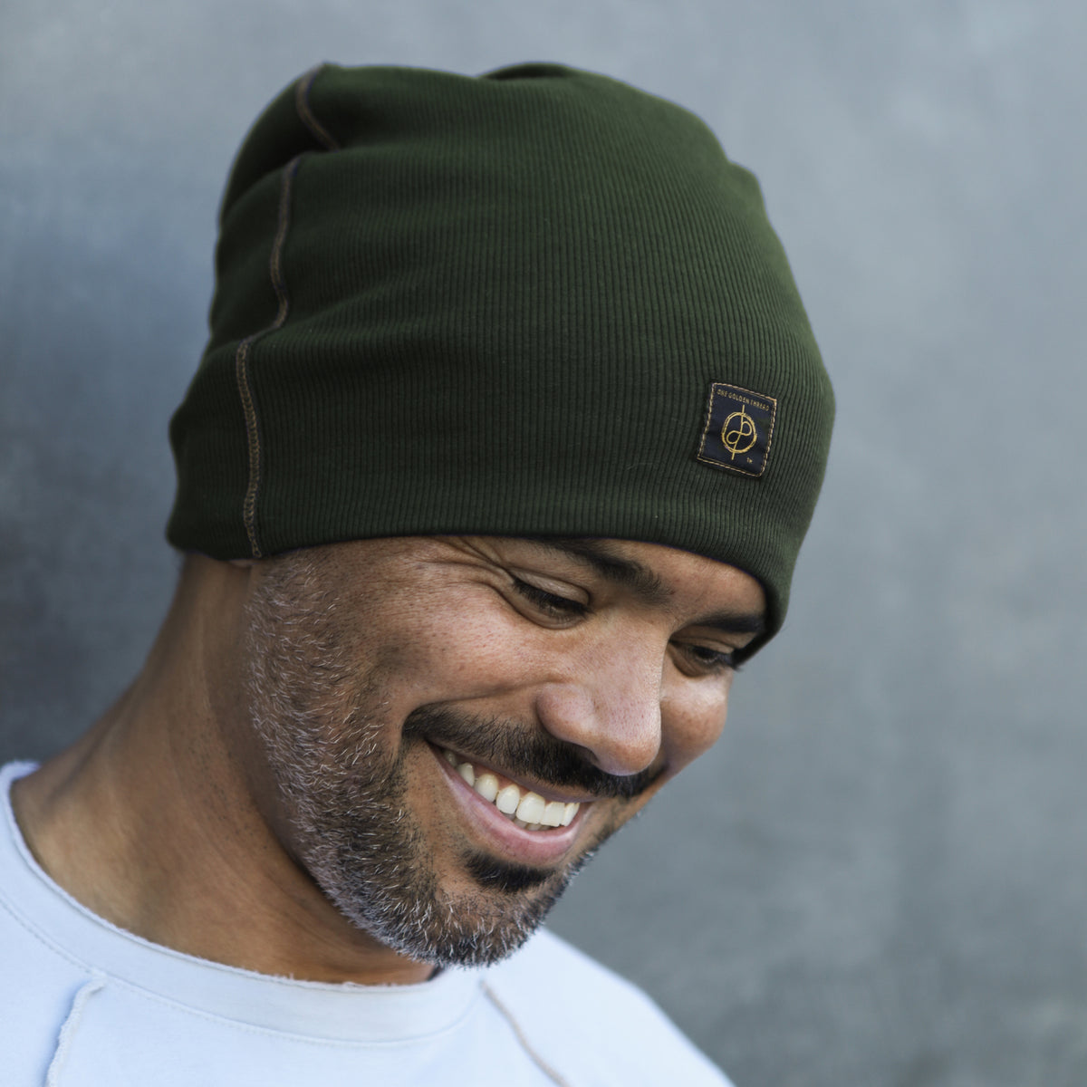 man modeling green beanie